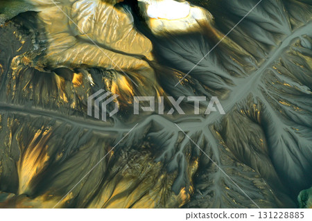 Aerial view of surreal natural patterns of gold cyanide leaching flowing into decanting lake 131228885