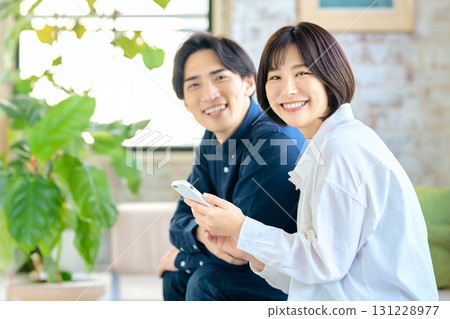 Young couple looking at a smartphone 131228977