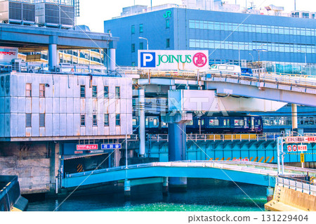 Yokohama cityscape in Japan, including a view of the Sotetsu Line train entering Yokohama Station 131229404