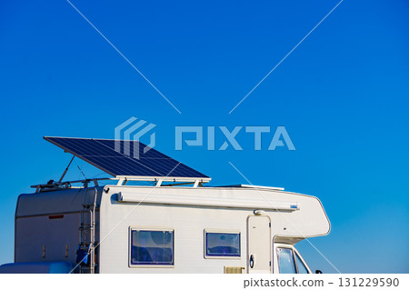 Caravan with tilt solar panels on roof. Caravan with tilt solar panels on roof. 131229590