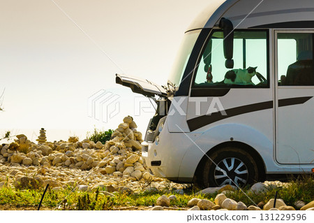 Broken camper car on beach 131229596