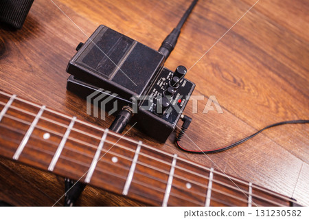 Black electric guitar with equipment 131230582