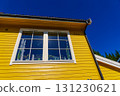 Window on yellow house wall 131230621