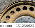 Old rusty car wheel rim closeup 131230623