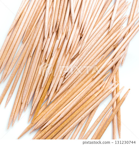 Wooden toothpicks as background closeup Wooden toothpicks as background closeup 131230744