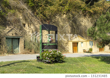 Traditional wooden wine press with wine cellar entrance in Schrattenberg, Mistelbach district, Weinviertel region, Lower Austria 131231485