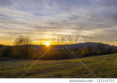 Scenic countryside sunset over Budina landscape hills 131231753