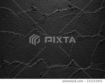 A horizontal background image of a dark, charcoal-colored earthen wall with trowel marks remaining 131231941