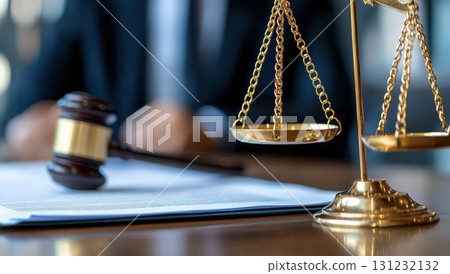 Close-up of a justice scale and gavel on a desk in a lawyer's office. Symbolizing law, legal proceedings, judiciary. Concept of justice, court, lawyer, courtroom, and jurisprudence 131232132