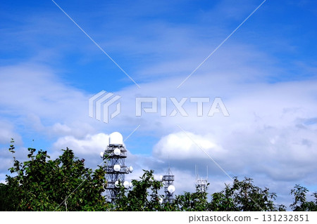Clouds and steel towers in the blue sky Clouds and steel towers in the blue sky 131232851