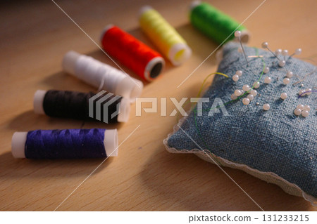 "Colorful sewing threads and pincushion with needles "Colorful sewing threads and pincushion with needles 131233215