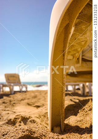Sun lounger on sandy beach with blue sky" Sun lounger on sandy beach with blue sky" 131233218