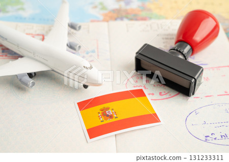 Spain passport with approved stamp on document for tourism to immigration at airport in country. Spain passport with approved stamp on document for tourism to immigration at airport in country. 131233311