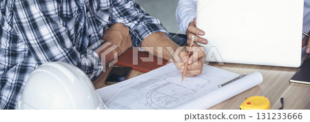 Banner Two engineer man look at blueprint architecture building contractor designer. Engineer holding project planing partner teamwork. Two Man meeting together construction site with copy space Banner Two engineer man look at blueprint architecture building contractor designer. Engineer holding project planing partner teamwork. Two Man meeting together construction site with copy space 131233666