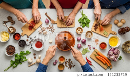 Hands preparing spices and ingredients for cooking together 131233719