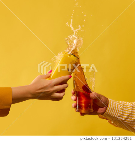 Exploding mockup beer can and glass splash with motion energy on yellow 131234291
