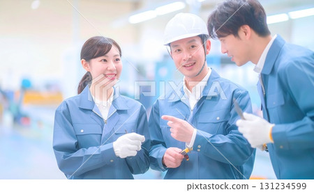 Male and female office workers in work clothes standing at the site Male and female office workers in work clothes standing at the site 131234599