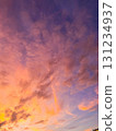 The sky is dramatically colored with passion. A dramatic sunset transitioning from orange to purple. 131234937