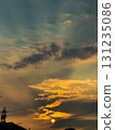 A golden light of hope. A dynamic landscape of dramatic clouds and a sunset. 131235086