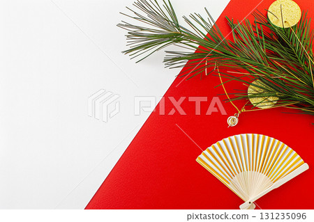 Japanese background of gold folding fan and pine branches to decorate the New Year 131235096