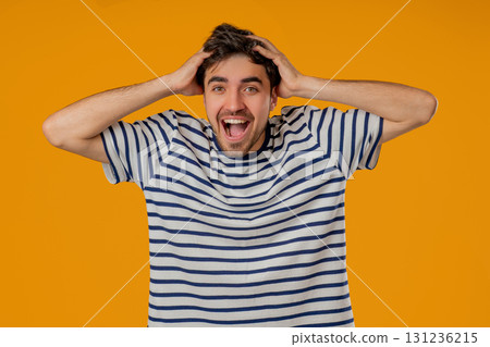 Amazed Man Shocked, Wow. Handsome Young Guy In Striped Shirt Surprised To Camera Amazed Man Shocked, Wow. Handsome Young Guy In Striped Shirt Surprised To Camera 131236215