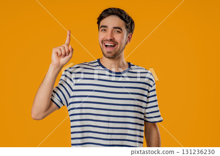 Genius Idea. Resourceful 20S Aged man has eureka Moment, Pointing Finger Up 131236230