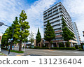 An apartment building facing the national highway under a refreshing autumn sky 131236404