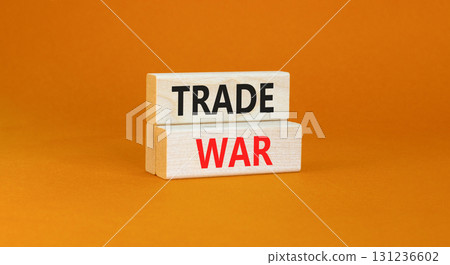 Trade war symbol. Concept word Trade war on beautiful wooden blocks. Beautiful orange paper background. Business trade war concept. Copy space. Trade war symbol. Concept word Trade war on beautiful wooden blocks. Beautiful orange paper background. Business trade war concept. Copy space. 131236602