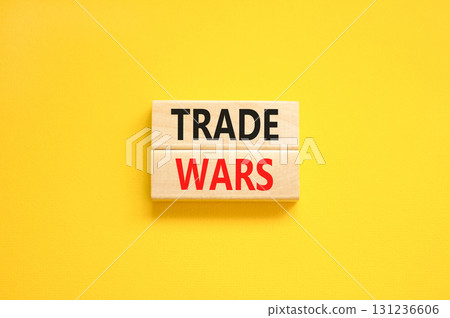 Trade wars symbol. Concept word Trade wars on beautiful wooden blocks. Beautiful yellow paper background. Business trade wars concept. Copy space. Trade wars symbol. Concept word Trade wars on beautiful wooden blocks. Beautiful yellow paper background. Business trade wars concept. Copy space. 131236606