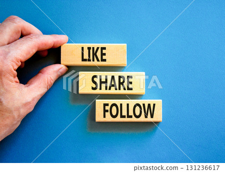 Like share follow symbol. Concept words Like Share Follow on beautiful wooden blocks. Beautiful blue background. Businessman hand. Business like share follow concept. Copy space. Like share follow symbol. Concept words Like Share Follow on beautiful wooden blocks. Beautiful blue background. Businessman hand. Business like share follow concept. Copy space. 131236617