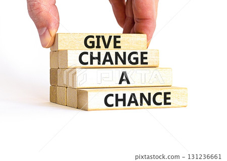 Give change a chance symbol. Concept words phrase Give change a chance on beautiful wooden blocks. Beautiful white paper background. Businessman's hand Business Give change a chance concept Copy space Give change a chance symbol. Concept words phrase Give change a chance on beautiful wooden blocks. Beautiful white paper background. Businessman's hand Business Give change a chance concept Copy space 131236661