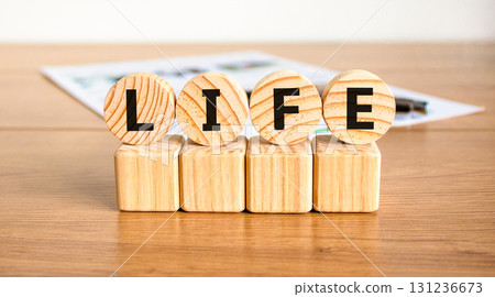 Life symbol. Concept word Life on beautiful wooden circles on wooden blocks. Beautiful wooden table white background. Business, lifestyle, support and life concept. Copy space. 131236673