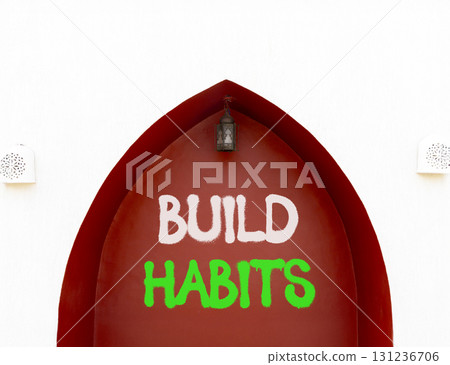 Build habits symbol. Concept word Build habits on beautiful white and red wall. Beautiful white and red wall background. Business build habits concept. Copy space. 131236706