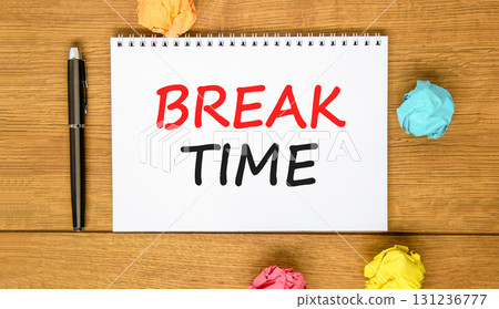 Break time symbol. Concept word Break time on beautiful white note. Black pen, colored paper. Beautiful wooden background. Business break time concept. Copy space. 131236777
