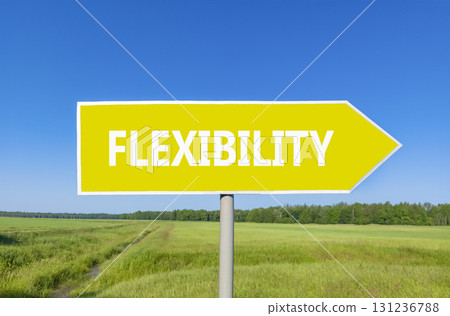 Flexibility symbol. Concept word Flexibility on beautiful yellow road sign. Beautiful blue sky green grass and forest peaceful nature background. Business flexibility concept. Copy space. Flexibility symbol. Concept word Flexibility on beautiful yellow road sign. Beautiful blue sky green grass and forest peaceful nature background. Business flexibility concept. Copy space. 131236788