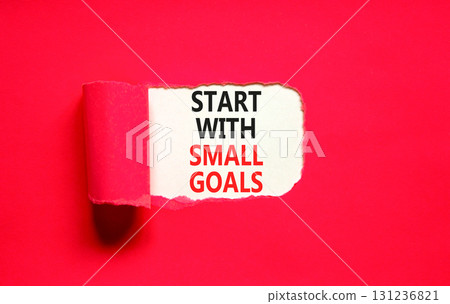 Start with small goals symbol. Concept words phrase Start with small goals on beautiful white paper. Beautiful red paper background. Business Start with small goals concept. Copy space. 131236821