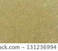 Sand ripple texture top view, Empty rough dry brown sand beach shore background, Grain pattern yellow sand dune in summer 131236994
