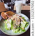A Caesar salad brunch served with a fresh mimosa 131237002