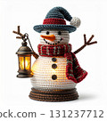Knitted Snowman Holding Lantern Ornament with Blue Hat and Red Scarf on White Background 131237712