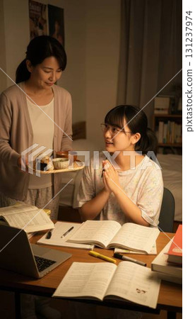 A high school girl with glasses who is grateful for her mother's late-night snack and studies hard A high school girl with glasses who is grateful for her mother's late-night snack and studies hard 131237974