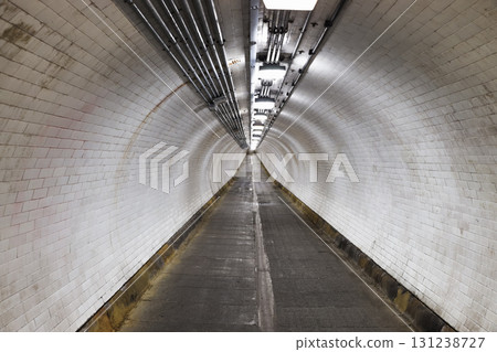Symmetrical Underground Pedestrian Tunnel with Vanishing Point Perspective 131238727