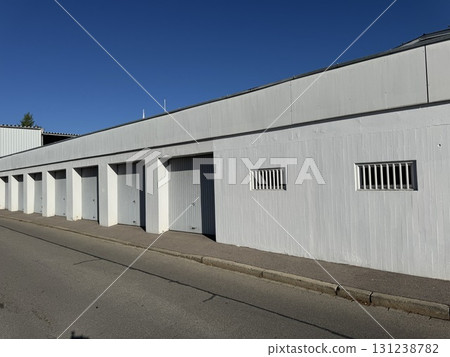 A Modern White Storage Facility Designed with Convenient Garage Doors A Modern White Storage Facility Designed with Convenient Garage Doors 131238782