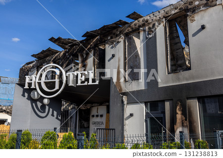 Bila Tserkva, Kyiv region, Ukraine - 09.06.2025: War. The aftermath of Russian airstrikes on a peaceful Ukrainian city. Fire damaged hotel with charred upper floor, collapsed roof, and broken windows Bila Tserkva, Kyiv region, Ukraine - 09.06.2025: War. The aftermath of Russian airstrikes on a peaceful Ukrainian city. Fire damaged hotel with charred upper floor, collapsed roof, and broken windows 131238813
