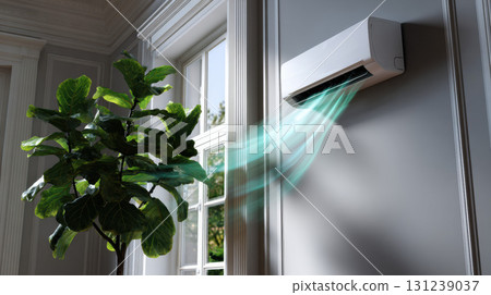 Modern white air conditioner on wall inside comfortable home. unit blowing cool, refreshing air into room next to window with green plant creates calm atmosphere Modern white air conditioner on wall inside comfortable home. unit blowing cool, refreshing air into room next to window with green plant creates calm atmosphere 131239037