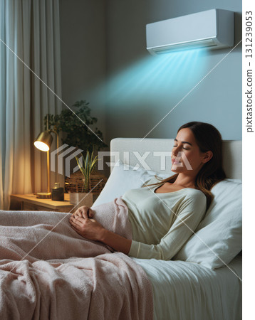 Peaceful woman sleeping in bed enjoys cool air from an air conditioner. climate control system uses sustainable energy for comfortable and tranquil night at home 131239053