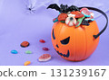 Various halloween sweets on pumpkin basket. Halloween 131239167