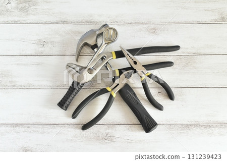 Tools collected on a white wood background Tools collected on a white wood background 131239423