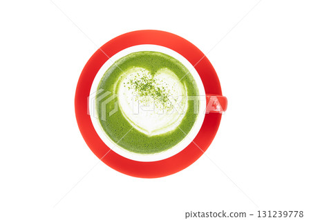 Top view of Matcha with heart shape latte art in a red cup on white isolated background 131239778