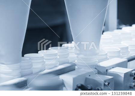 The medicine bottle on the conveyor blet for filling process. 131239848