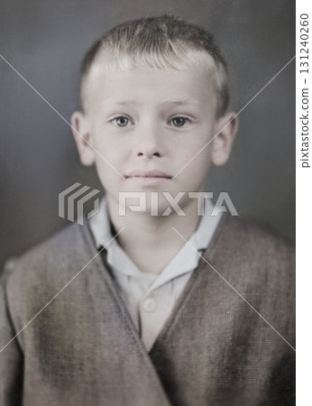 A vintage portrait of a cute, blond, six-year-old boy in a suit. Retro photo from 1972. 131240260